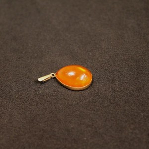 Silver pendant with amber